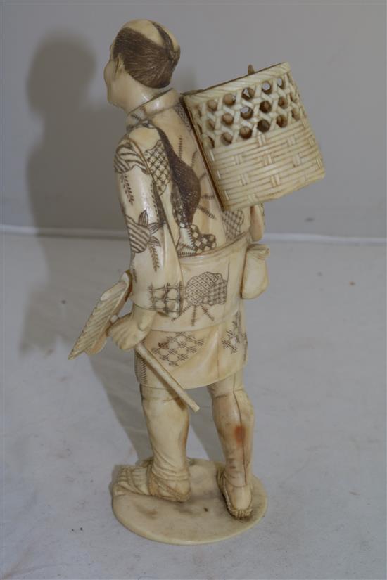 A Japanese sectional ivory figure of a fisherman, early 20th century, 23.5cm